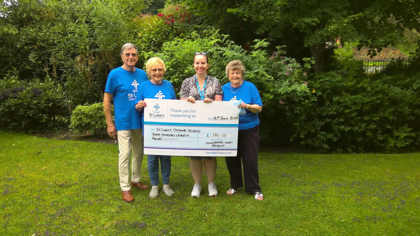 Residents present cheque to St Luke's Hospice