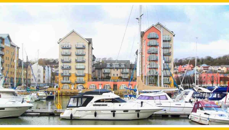 Centre Quay marina with boats and apartment buildings.
