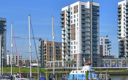 Modern apartment buildings by a marina.