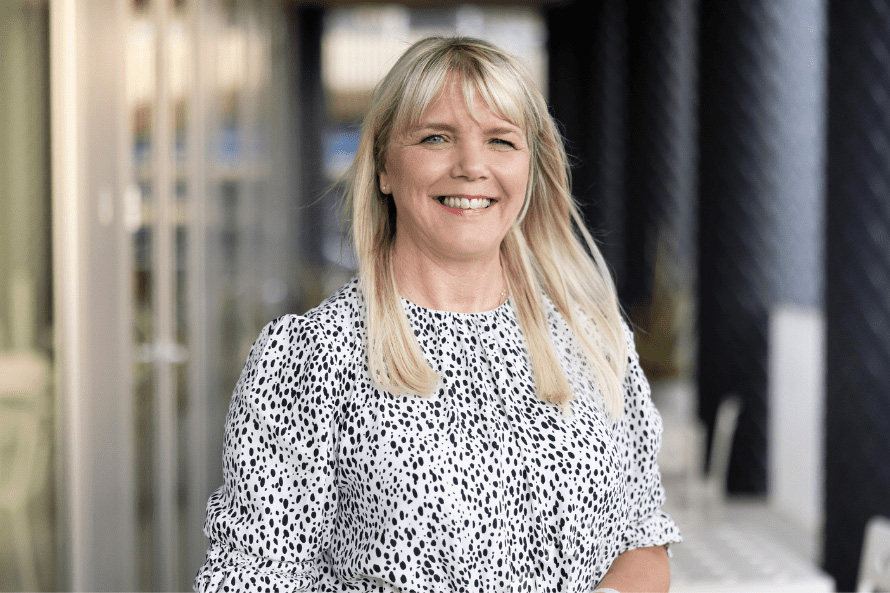 Headshot of Emma Melhuish, smiling.